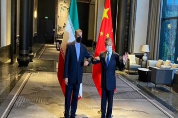 وزيرا خارجية ايران والصين يبحثان تعزيز العلاقات الثنائية + صورة