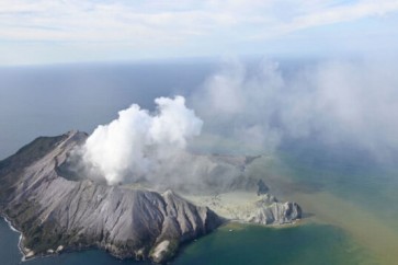 This aerial photo shows White Island after its volcanic eruption in New Zealand Monday, Dec. 9, 2019. The volcano on a small New Zealand island frequented by tourists erupted Monday, and a number of people were missing and injured after the blast. (George Novak/New Zealand Herald via AP)