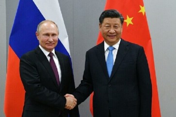 الرئيس فلادمير بوتين ونظيره الصيني شي جين بينغ